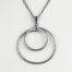 Double Happiness Double Circle Necklace in Hammered Iron. The two handmade, hammered, concentric circles on a sterling silver chain reflect with lovely contrasting iron tones. Together, the Double Happiness iron double Circle Necklace is a simple necklace to wear everyday, or perfect for a fancy night on the town. A perfect iron 6th anniversary gift.