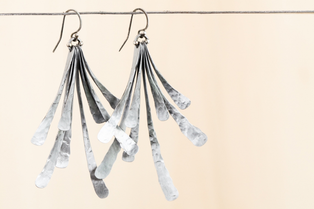 Fan polli are bold and simple design and steel earrings