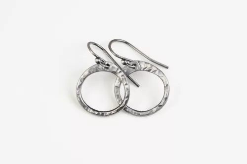 Simple Zen Circle small drop hoop earrings - steel 11th anniversary gift for her. Handmade small drop hoop earrings with hammered steel chunky hoops creating a lovely faceted surface that reflects the light. Sterling silver ear wires match the steels bright tones. A perfect 11th anniversary gift for her.
