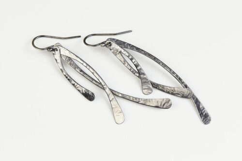 Trio - Handmade Dangle Earrings in Hammered Iron 6th anniversary gift for her. A trio of hand forged gently hammered curving dangles creates the focal point of these elegant iron earrings. Sterling silver ear wires match the bright faceted iron dangles making a perfect 6th anniversary iron gift for your wife.