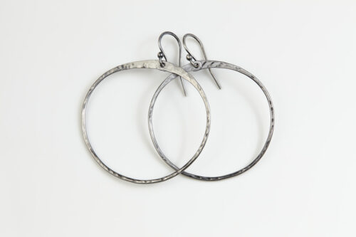 Zen Circle Boho Hoop Earrings in Iron feature hand forged iron hammered hoops that are polished to a bright shine. The sterling silver ear wires match the bright polished iron tones. These simple and minimalist boho hoop earrings are perfect for every day or for a fancy night out on the town. A perfect 6th anniversary gift for her.