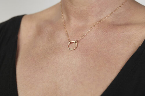 The Tiny Zen Circle - Bronze Simple Circle Necklace. Featuring a simple hammered bronze circle embodying the Japanese concept of Enso, the Tiny Zen Circle - Bronze Simple Circle Necklace is a beautifully understated yet striking necklace. The hammered bronze reflects the warm light in facets creating a lovely and simple everyday necklace. The gold fill chain matches the warm tones of the bronze perfectly. Small and light enough for every day, but sophisticated enough for a fancy night out, The Tiny Zen Circle - copper Simple Circle Necklace is a perfect gift for every occasion and makes a lovely Bronze 8th anniversary gift for her