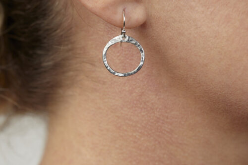Tiny Zen Circle - Aluminum Tiny Hoop Earrings. These small drop hoop earrings are hand hammered creating a lovely faceted surface that highlights the contrasting reflectivity of these simple and beautiful handmade Aluminum Tiny Hoop Earrings. 10th anniversary gift for her.