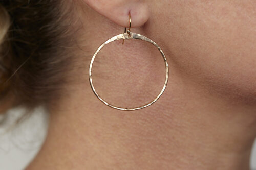 The Zen Circle - Chunky Hoops Bronze Earrings. Displayed on a white background, Feature simple hammered bronze circles embodying the Japanese concept of Enso, the Zen Circle - bronze hammered hoop earrings are beautifully understated yet striking earrings. The hammered bronze reflects the warm light in facets creating a lovely and simple everyday earrings. The gold fill ear wires match the warm tones of the bronze perfectly. Small and light enough for every day, but sophisticated enough for a fancy night out, The Zen Circle - Chunky Hoops Bronze Earrings are a perfect gift for any occasion. Bronze 8th anniversary gifts