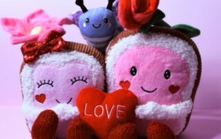 two stuffed toys celebrating their 10th anniversary celebration